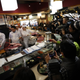 Kimura slicing up a section of the fish at a Sushizanmai location in Tokyo.